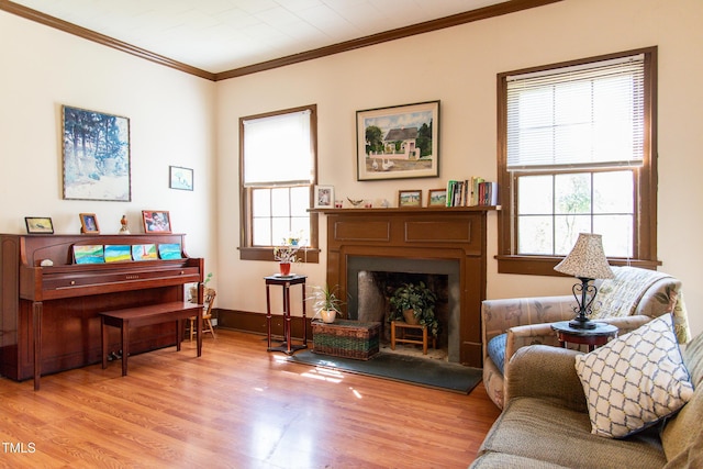 1556 Pleasants Rd, Wendell, NC 27591 - interior space featuring crown molding, baseboards, wood finished floors, and a fireplace