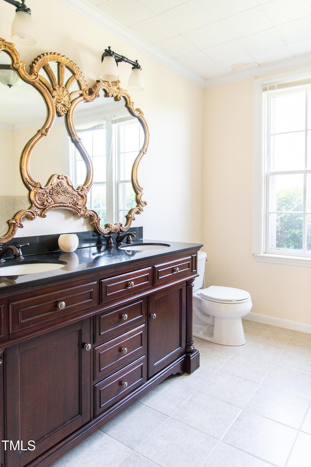1556 Pleasants Rd, Wendell, NC 27591 - bathroom featuring double vanity, ornamental molding, tile patterned floors, toilet, and a sink