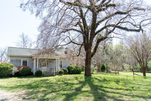 1556 Pleasants Rd, Wendell, NC 27591 - view of front of home with a front yard, covered porch, and roof with shingles