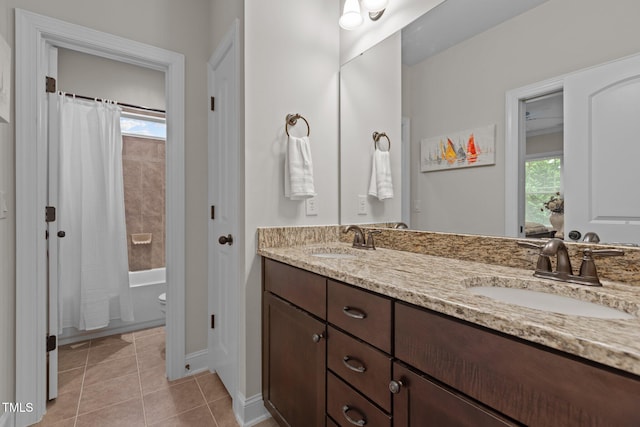 1512 Piazzo Ct, Apex, NC 27502 - bathroom featuring double vanity, tile patterned floors, shower / tub combo, baseboards, and toilet