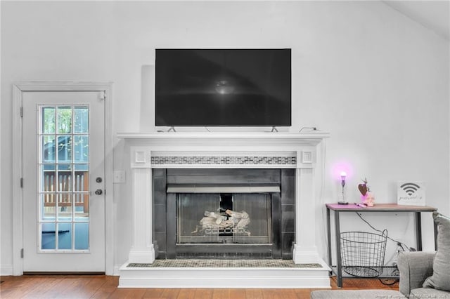 details with wood finished floors and a fireplace