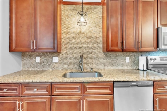 kitchen with a sink, backsplash, light stone countertops, and stainless steel appliances