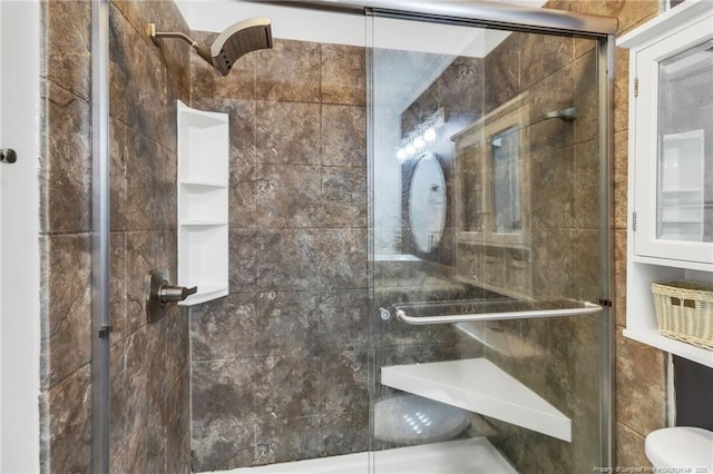 bathroom with a shower stall