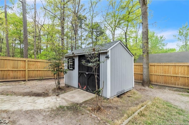 view of shed featuring a fenced backyard