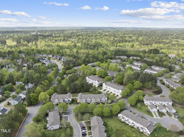 aerial view featuring a view of trees and a residential view