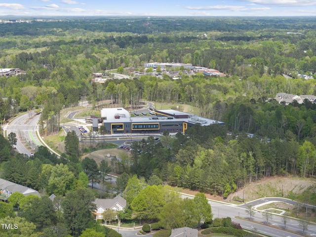 drone / aerial view featuring a view of trees