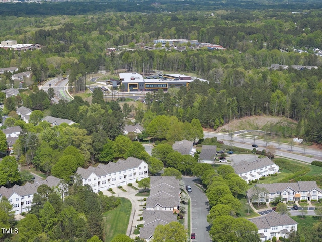 aerial view with a wooded view and a residential view