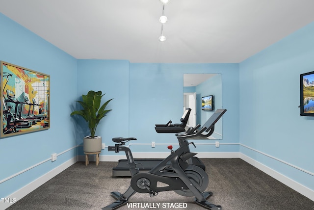 exercise area with baseboards