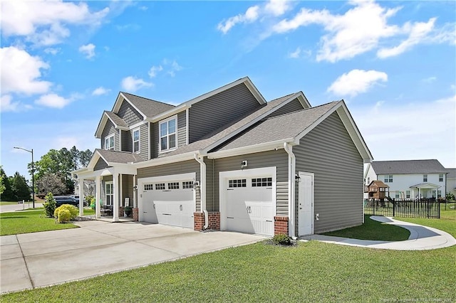 view of side of home with a yard, fence, brick siding, and driveway