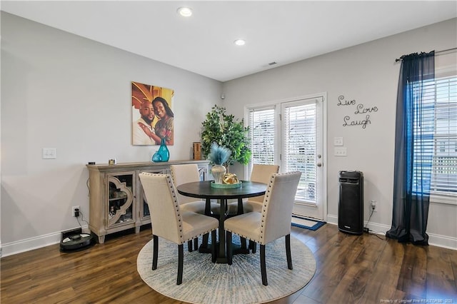 dining room with dark wood-style flooring, baseboards, and recessed lighting