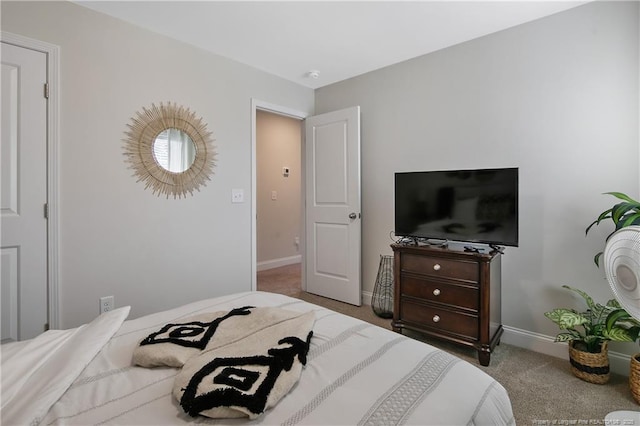bedroom with carpet flooring and baseboards
