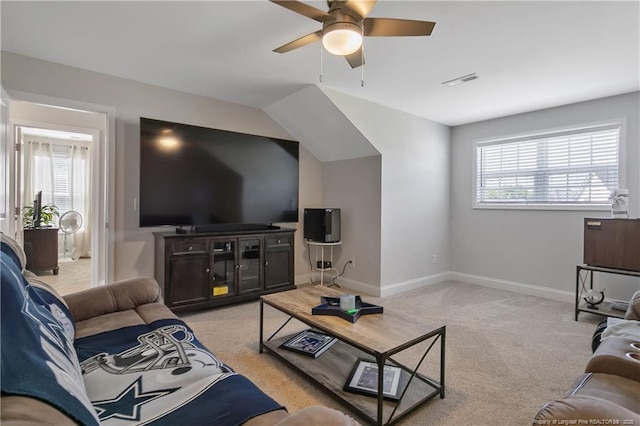 living room with light carpet, ceiling fan, visible vents, and a wealth of natural light