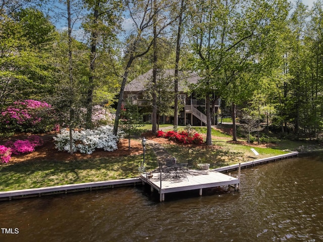 955 Sagamore Dr, Louisburg, NC 27549 - view of dock featuring a water view, a lawn, and stairs