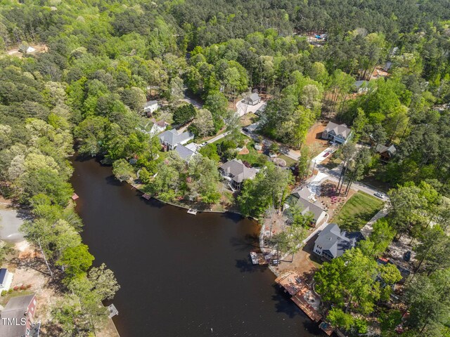955 Sagamore Dr, Louisburg, NC 27549 - birds eye view of property featuring a wooded view and a water view