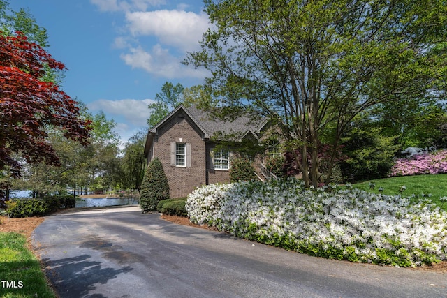 955 Sagamore Dr, Louisburg, NC 27549 - view of side of property featuring brick siding and aphalt driveway