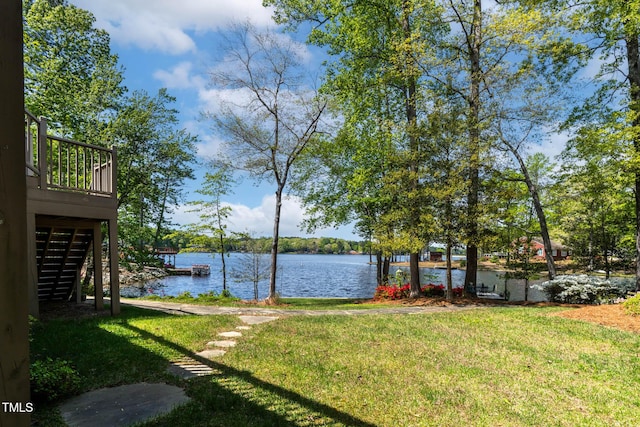 955 Sagamore Dr, Louisburg, NC 27549 - view of yard featuring a boat dock, a deck with water view, and stairs