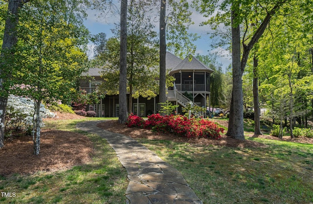 955 Sagamore Dr, Louisburg, NC 27549 - view of front of property featuring a sunroom, a front yard, and stairs