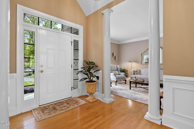 955 Sagamore Dr, Louisburg, NC 27549 - foyer entrance with crown molding, wood finished floors, and decorative columns