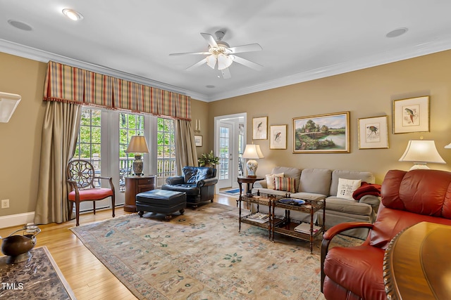 955 Sagamore Dr, Louisburg, NC 27549 - living area featuring ornamental molding, light wood-style flooring, a ceiling fan, and baseboards
