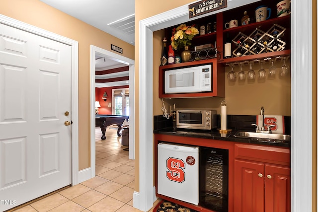 955 Sagamore Dr, Louisburg, NC 27549 - bar featuring white microwave, pool table, indoor wet bar, light tile patterned flooring, and a sink