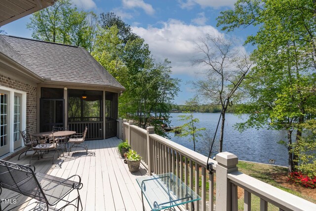 955 Sagamore Dr, Louisburg, NC 27549 - deck featuring a water view, outdoor dining area, and a sunroom
