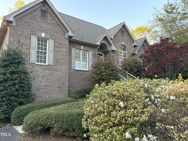 955 Sagamore Dr, Louisburg, NC 27549 - view of front of home with brick siding and a shingled roof