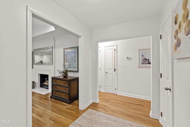 4902 Brookhaven Dr, Raleigh, NC 27612 - corridor with light wood-style flooring, baseboards, and ornamental molding