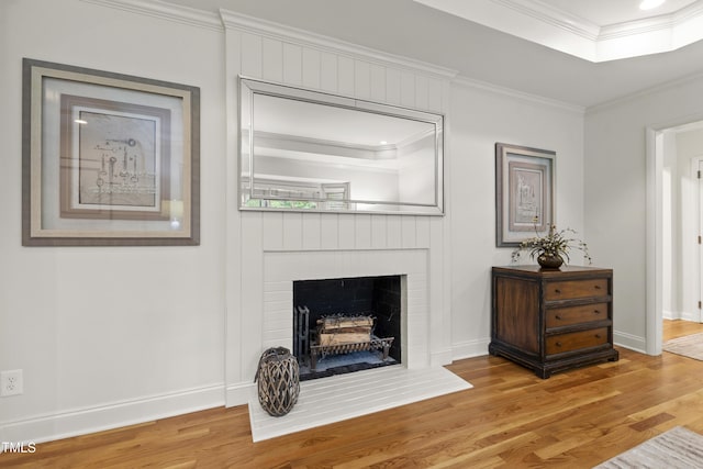 4902 Brookhaven Dr, Raleigh, NC 27612 - living room featuring wood finished floors, crown molding, baseboards, and a fireplace