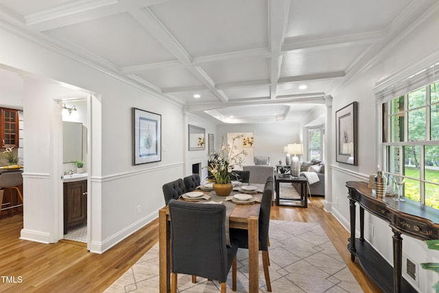 4902 Brookhaven Dr, Raleigh, NC 27612 - dining space featuring coffered ceiling, light wood-style flooring, plenty of natural light, beamed ceiling, and baseboards