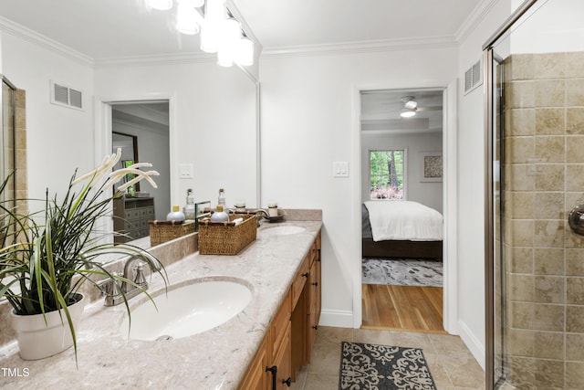 4902 Brookhaven Dr, Raleigh, NC 27612 - ensuite bathroom featuring a stall shower, ornamental molding, tile patterned floors, double vanity, and baseboards
