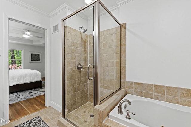 4902 Brookhaven Dr, Raleigh, NC 27612 - ensuite bathroom featuring a stall shower, a bath, crown molding, tile patterned flooring, and baseboards