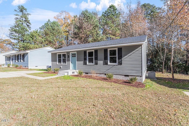 view of front facade with crawl space, a shingled roof, a front lawn, and central air condition unit