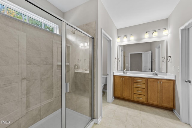219 Zante Currant Rd, Durham, NC 27703 - full bathroom featuring tile patterned flooring, toilet, a sink, a stall shower, and double vanity