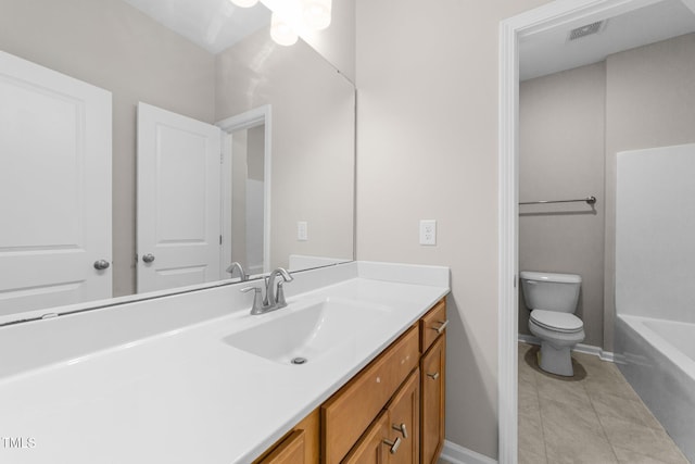 219 Zante Currant Rd, Durham, NC 27703 - full bathroom featuring toilet, vanity, baseboards, and a tub to relax in