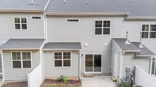 219 Zante Currant Rd, Durham, NC 27703 - back of house featuring roof with shingles, a patio, and fence