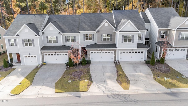 219 Zante Currant Rd, Durham, NC 27703 - view of property featuring an attached garage, a shingled roof, and driveway
