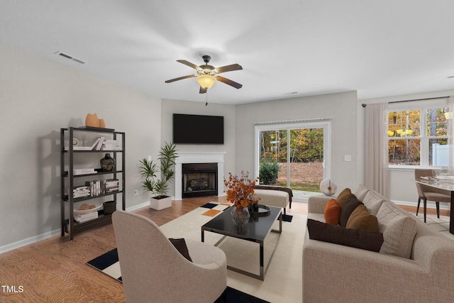 219 Zante Currant Rd, Durham, NC 27703 - living area featuring wood finished floors, baseboards, and plenty of natural light