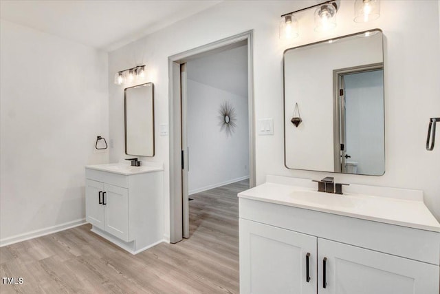 1506 Darby Rd, Goldsboro, NC 27534 - bathroom featuring wood finished floors and two vanities