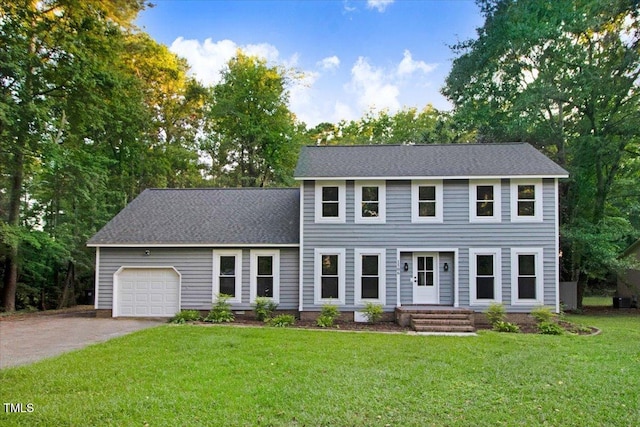 1506 Darby Rd, Goldsboro, NC 27534 - colonial house with an attached garage, driveway, a front lawn, and a shingled roof