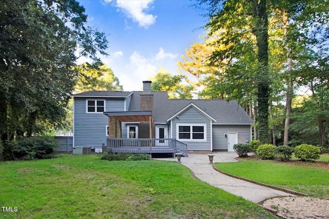 1506 Darby Rd, Goldsboro, NC 27534 - rear view of property featuring a wooden deck and a chimney