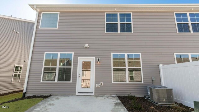 2318 Sugar Cone Way, Fuquay Varina, NC 27526 - back of property featuring central AC and fence