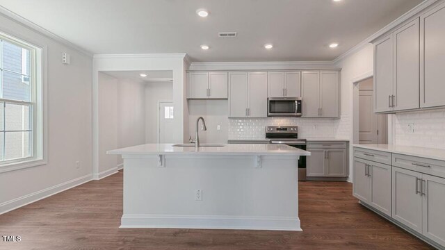 2318 Sugar Cone Way, Fuquay Varina, NC 27526 - kitchen with gray cabinets, dark wood-type flooring, visible vents, appliances with stainless steel finishes, and a sink