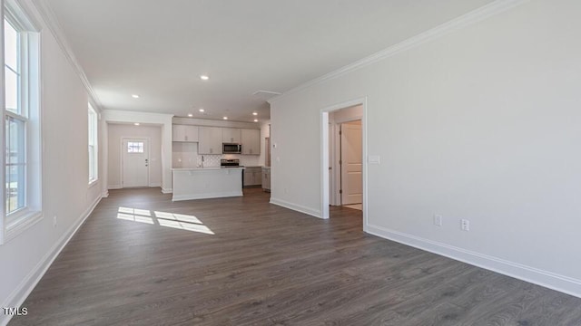 2318 Sugar Cone Way, Fuquay Varina, NC 27526 - unfurnished living room featuring ornamental molding, baseboards, recessed lighting, and dark wood finished floors