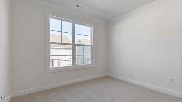 2318 Sugar Cone Way, Fuquay Varina, NC 27526 - empty room with light carpet, visible vents, baseboards, and crown molding