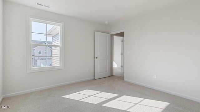 2318 Sugar Cone Way, Fuquay Varina, NC 27526 - unfurnished bedroom featuring visible vents, baseboards, and light carpet