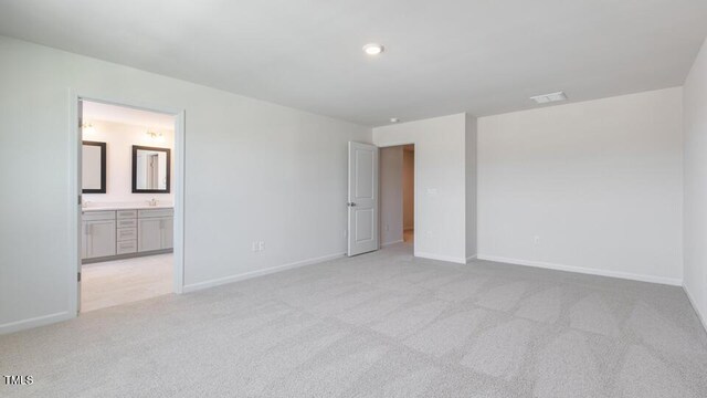 2318 Sugar Cone Way, Fuquay Varina, NC 27526 - unfurnished bedroom with light carpet, baseboards, and ensuite bath