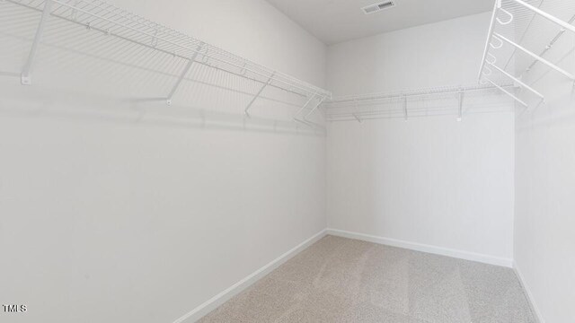 2318 Sugar Cone Way, Fuquay Varina, NC 27526 - spacious closet featuring visible vents and carpet floors
