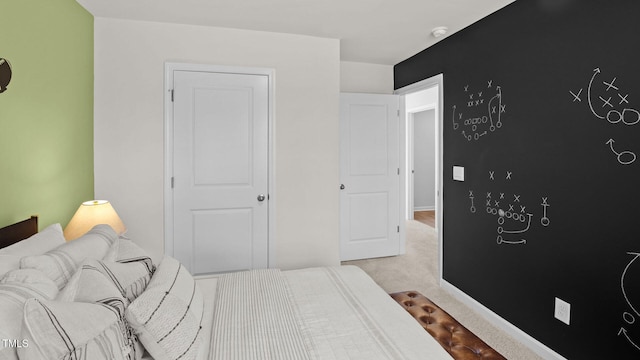 bedroom with carpet flooring and baseboards