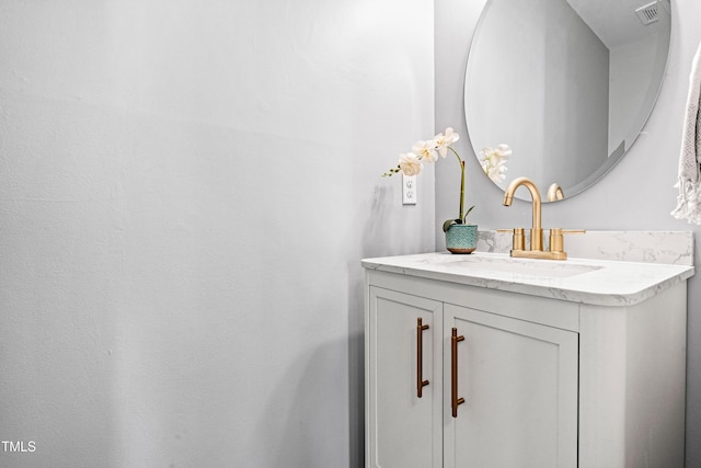 bathroom featuring vanity and visible vents