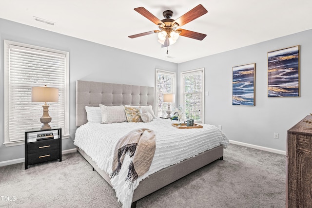 bedroom with visible vents, baseboards, a ceiling fan, and carpet floors